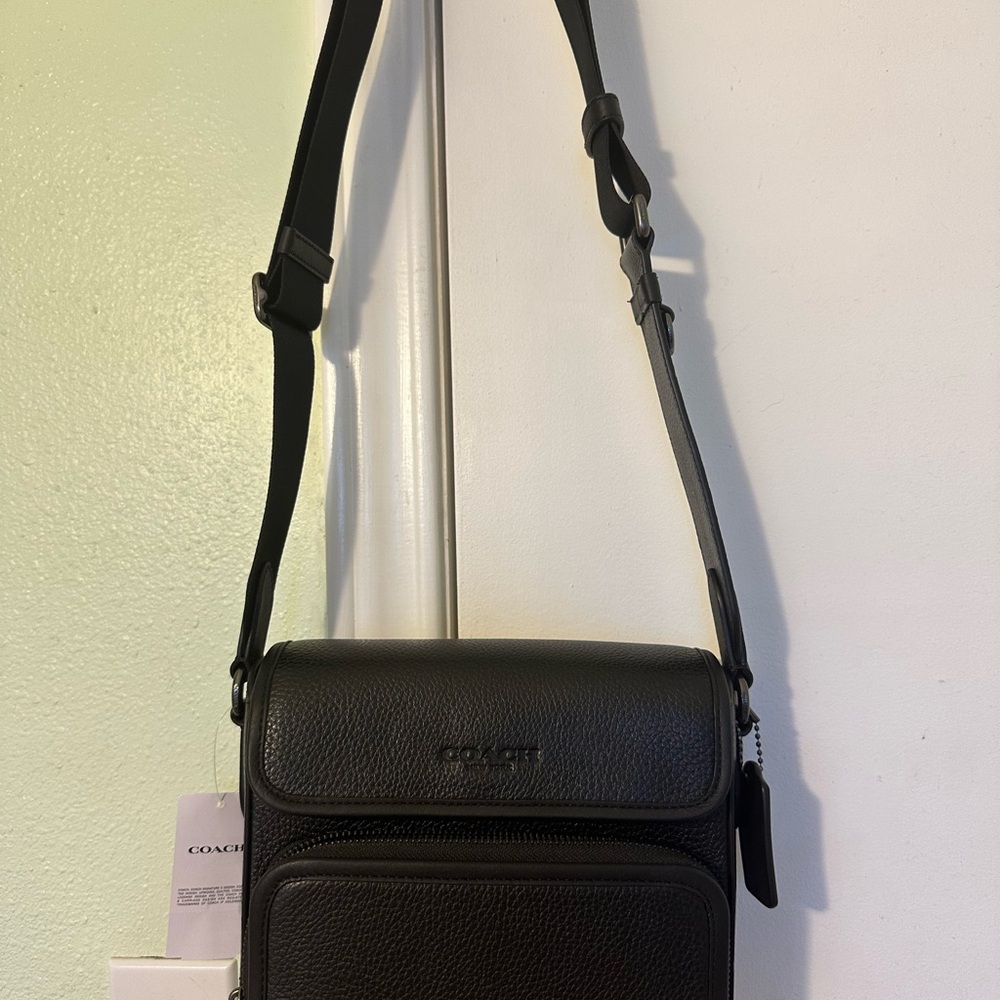 Coach Black Messenger Bag with Adjustable Strap and Flap Closure